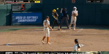 A softball game between Arizona State and Texas, with Texas leading 5-0 in the 7th inning.