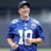 Eli Manning is all smiles after throwing out a ceremonial first pitch during a Yankees game in 2024.