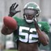 Jets' Anthony Wint during practice, catching a football.