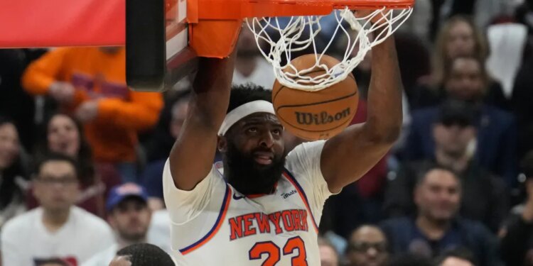 Mitchell Robinson dunks during Game 4 of the Eastern Conference finals.