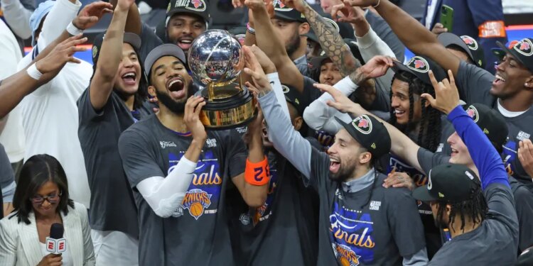 Karl-Anthony Towns and the Knicks celebrate with the Bob Cousy trophy after winning the Eastern Conference finals on May 25, 2026.