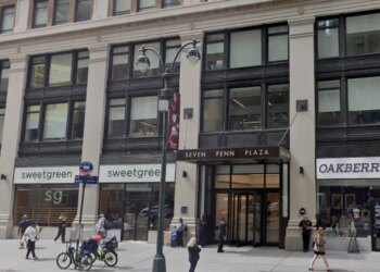 Exterior view of Seven Penn Plaza in New York City with Sweetgreen and Oakberry storefronts.