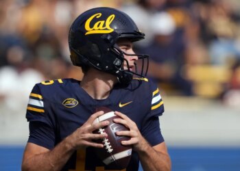 California Golden Bears quarterback Fernando Mendoza holding a football.