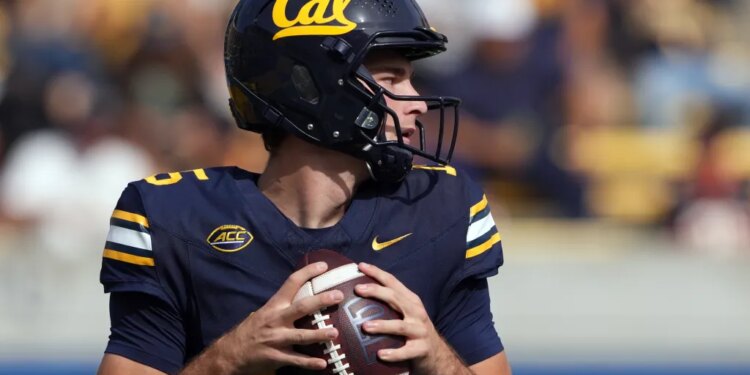California Golden Bears quarterback Fernando Mendoza holding a football.