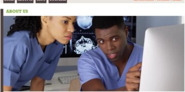 Homepage for FindABlackDoctor.com featuring two doctors looking at a computer monitor displaying brain scans.