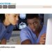 Homepage for FindABlackDoctor.com featuring two doctors looking at a computer monitor displaying brain scans.
