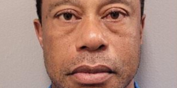 Tiger Woods poses for a mugshot.