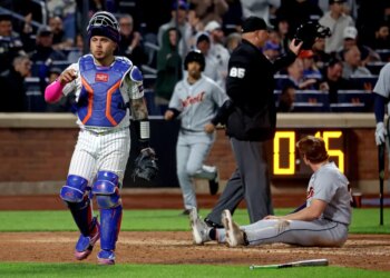 New York Mets catcher Francisco Alvarez (4) tags out Detroit Tigers third baseman Colt Keith (33) on a play at the plate ending the fifth inning.