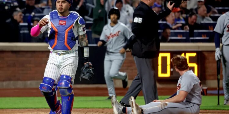 New York Mets catcher Francisco Alvarez (4) tags out Detroit Tigers third baseman Colt Keith (33) on a play at the plate ending the fifth inning.
