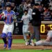 New York Mets catcher Francisco Alvarez (4) tags out Detroit Tigers third baseman Colt Keith (33) on a play at the plate ending the fifth inning.