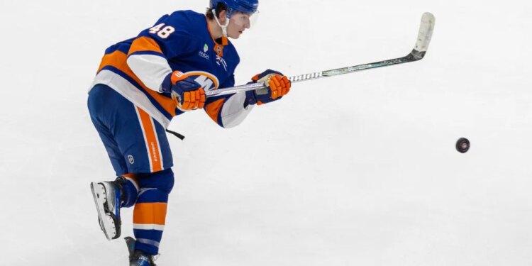New York Islanders defenseman Matthew Schaefer (48) shoots during the third period against the Carolina Hurricanes at UBS Arena, Tuesday, April 14, 2026