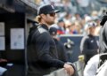New York Yankees player Gerrit Cole in the dugout during a baseball game.