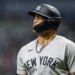 Giancarlo Stanton in a New York Yankees uniform and batting helmet.