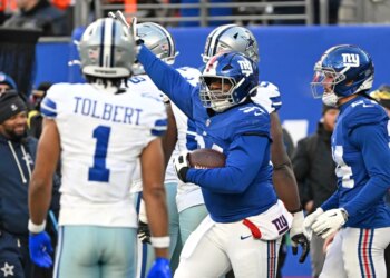 Giants defensive tackle Elijah Chatman (94) reacts during a football game.