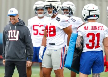 John Harbaugh (l.) and the Giants won't have joint practices with the Jets this summer.