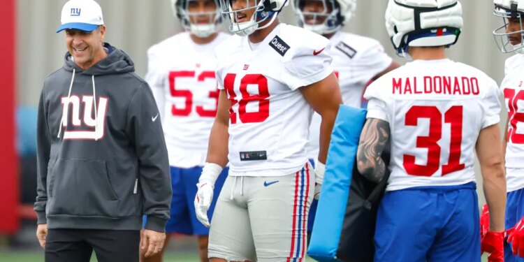 John Harbaugh (l.) and the Giants won't have joint practices with the Jets this summer.