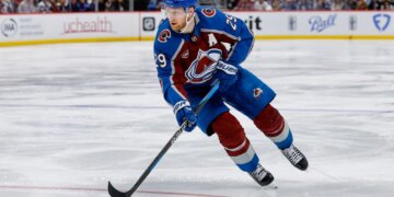 Colorado Avalanche center Nathan MacKinnon (29) controls the puck in overtime against the Minnesota Wild.
