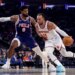 New York Knicks guard Jalen Brunson (11) drives to the basket as Philadelphia 76ers forward Paul George (8) defends.