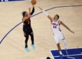New York Knicks guard Jalen Brunson (11) shoots over Philadelphia 76ers forward Dominick Barlow (25).