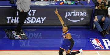 New York Knicks guard Jalen Brunson (11) reacting after scoring against the Philadelphia 76ers.