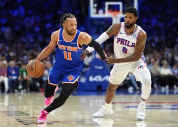 Knicks guard Jalen Brunson (11) drives against 76ers forward Paul George (8) during Game 4 on May 10, 2026.