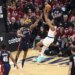 New York Knicks guard Mikal Bridges (25) shoots as Cleveland Cavaliers guard James Harden (1) defends.