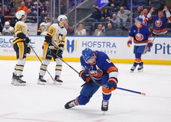New York Islanders player Ryan Pulock reacts after scoring a goal against the Pittsburgh Penguins.