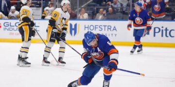 New York Islanders player Ryan Pulock reacts after scoring a goal against the Pittsburgh Penguins.