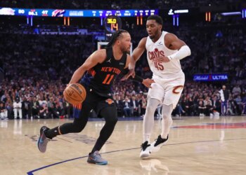 New York Knicks guard Jalen Brunson #11 drives to the basket as Cleveland Cavaliers guard Donovan Mitchell #45 gives chase in the 2nd quarter.