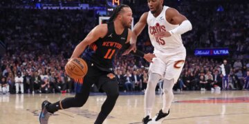 New York Knicks guard Jalen Brunson #11 drives to the basket as Cleveland Cavaliers guard Donovan Mitchell #45 gives chase in the 2nd quarter.