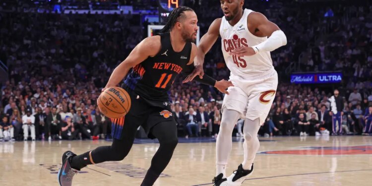 New York Knicks guard Jalen Brunson #11 drives to the basket as Cleveland Cavaliers guard Donovan Mitchell #45 gives chase in the 2nd quarter.