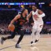 New York Knicks guard Jalen Brunson #11 drives to the basket as Cleveland Cavaliers guard Donovan Mitchell #45 gives chase in the 2nd quarter.