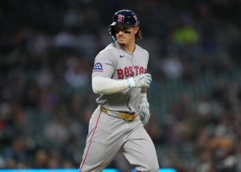 Boston Red Sox's Jarren Duran looking to his bench after walking against the Detroit Tigers.