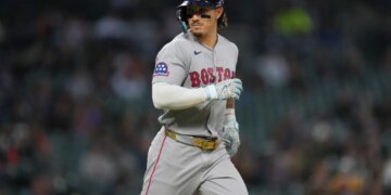 Boston Red Sox's Jarren Duran looking to his bench after walking against the Detroit Tigers.