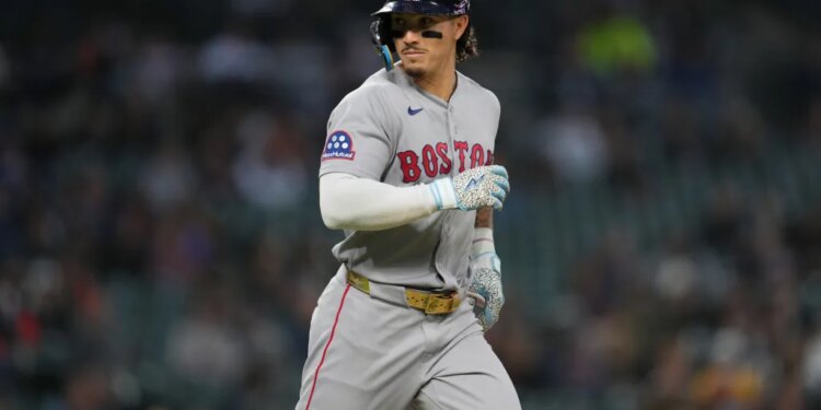 Boston Red Sox's Jarren Duran looking to his bench after walking against the Detroit Tigers.