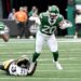 Jets running back Breece Hall (20) runs the ball as Steelers cornerback Darius Slay (23) tries to tackle during the first quarter of the Jets and Pittsburgh Steelers game in East Rutherford, NJ.