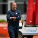 Robert Saleh, head coach for the Tennessee Titans, smiling with his arms crossed during the NFL team's rookie minicamp.