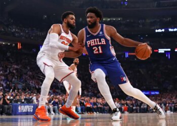 Knicks center Karl-Anthony Towns (32) defends the 76ers' Joel Embiid (21) during Game 1 of the second round on May 4, 2026.