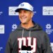 New York Giants head coach John Harbaugh speaking at a press conference.