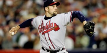 Atlanta Braves pitcher John Smoltz mid-pitch.