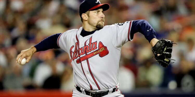 Atlanta Braves pitcher John Smoltz mid-pitch.