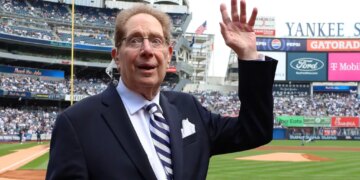 John Sterling waves to the crowd while he is honored by the Yankees in a pre-game ceremony as he retires as âThe Voice Of The Yankeesâ when the New York Yankees played the Tampa Bay Rays Saturday, April 20, 2024 at Yankee Stadium in the Bronx, NY. (For the NY POST Photo/Robert Sabo) New York Yankees v Tampa Bay Rays