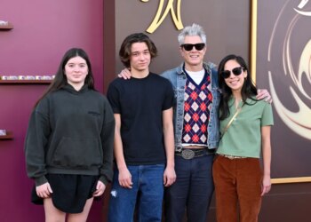 Johnny Knoxville and Emily Ting pose with Arlo Clapp and Rocko Akira Clapp.