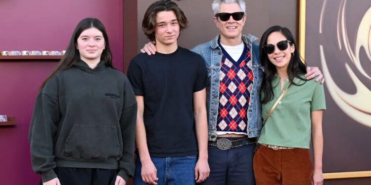 Johnny Knoxville and Emily Ting pose with Arlo Clapp and Rocko Akira Clapp.