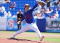 New York Mets pitcher Jonah Tong throws a pitch during spring training.