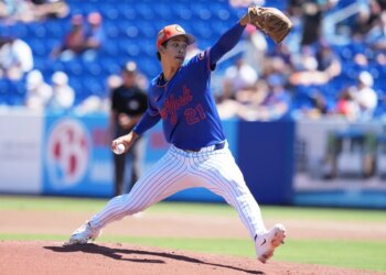 New York Mets pitcher Jonah Tong throws a pitch during spring training.