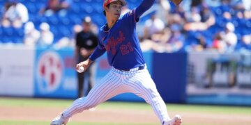 New York Mets pitcher Jonah Tong throws a pitch during spring training.