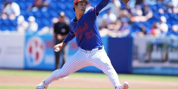 New York Mets pitcher Jonah Tong throws a pitch during spring training.