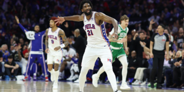 Philadelphia 76ers center Joel Embiid reacts after a three-pointer against the Boston Celtics.
