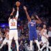 New York Knicks center Karl-Anthony Towns #32 puts up a shot over Philadelphia 76ers center Joel Embiid #21 in the first quarter of an NBA playoff game.